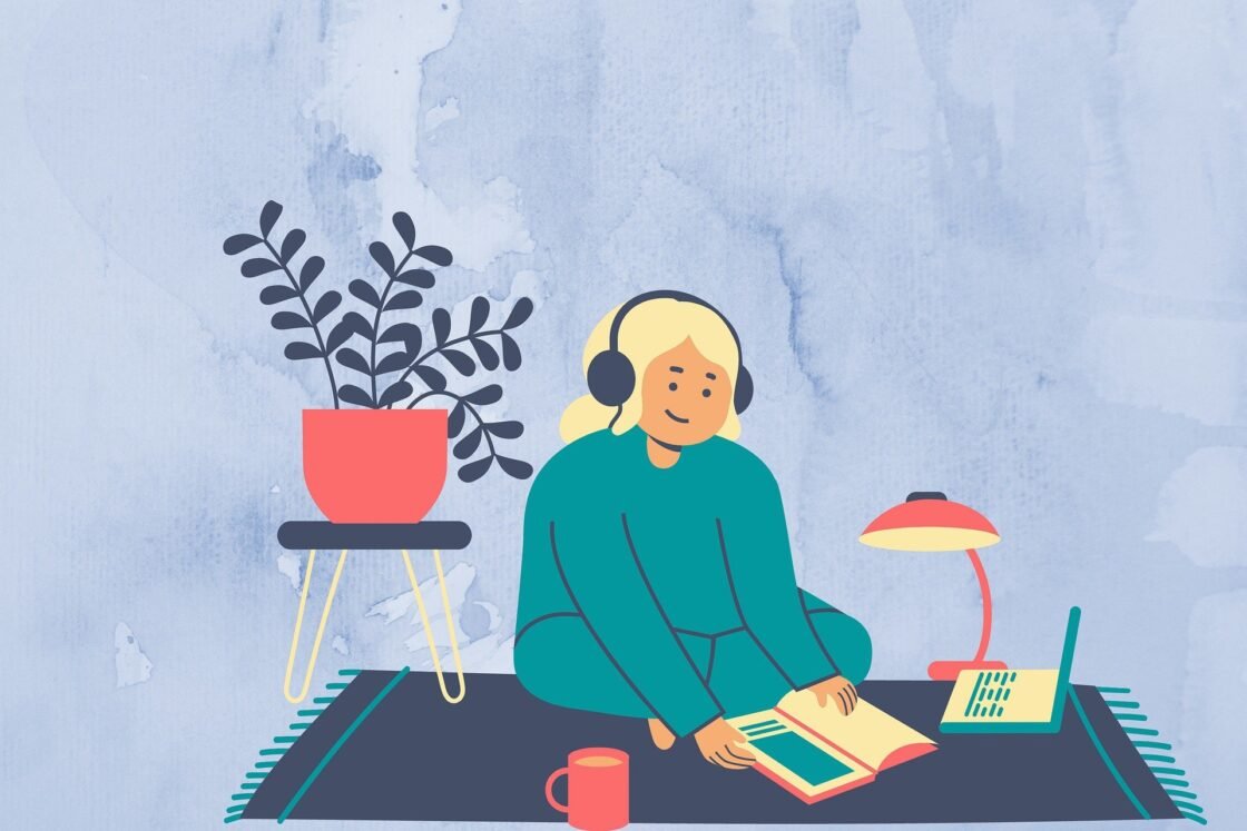 Persona escuchando un audiolibro mientras se relaja, disfrutando de la lectura en formato audio.