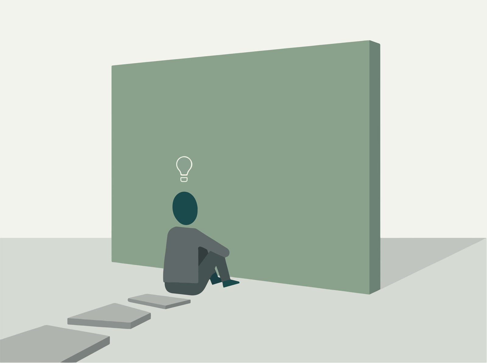 Persona sentada reflexionando frente a una pared que simboliza bloqueo mental y parálisis por análisis